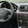 Mazda-3-2003-pred-faceliftem-interier-s-OEM-autoradiem